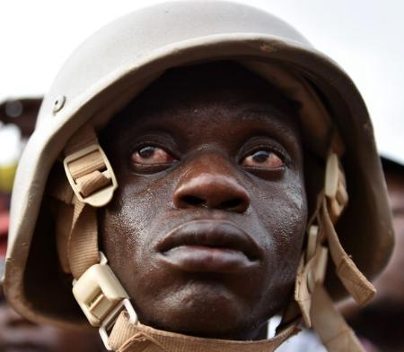 A Burkinabe soldier - caught in the middle of a project he does not understand as his bosses fight over the spoils. His bloodshot and bewildered eyes say it all.