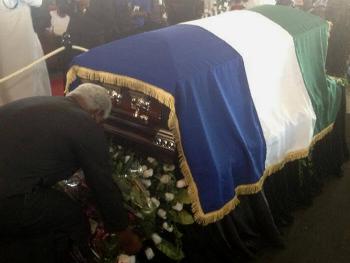 President Koroma stoops to lay a wreath in honour of the late President Ahmad Tejan Kabbah.