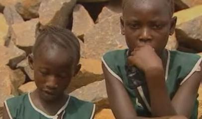 Girls in Sierra Leone working on rocks to pay school fees