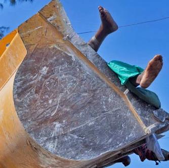 Bodies are loaded into trucks...Oh Haiti