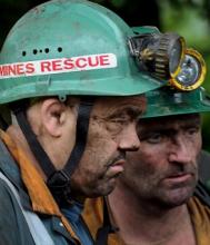 The look of despair on the faces of two rescuers