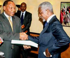 Justice Waki (left) hands a copy of the report to Kofi Annan